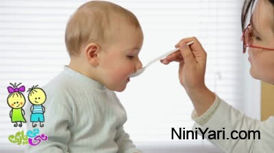 stock footage pediatrician gives a baby medicine liquid syrup