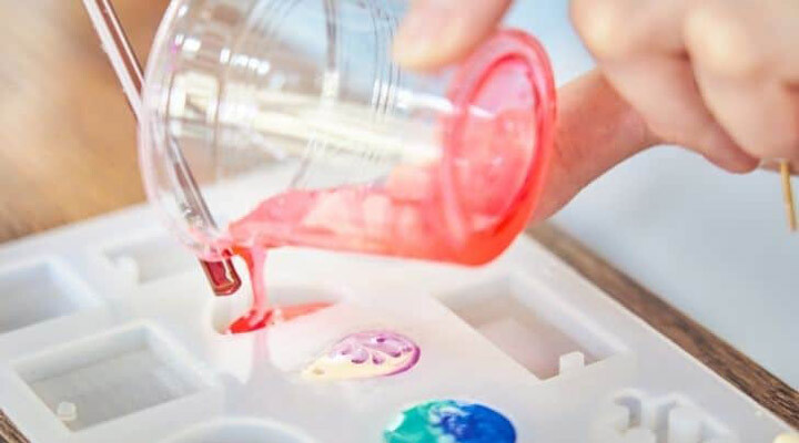 pouring-red-resin-into-resin-mold.jpg